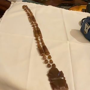 Carved stone necklace from Spain.  Beautiful brown stone, a real special piece.